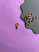 Load image into Gallery viewer, Hand holding circle clasps
